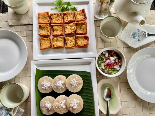 A table with plates of Thai food